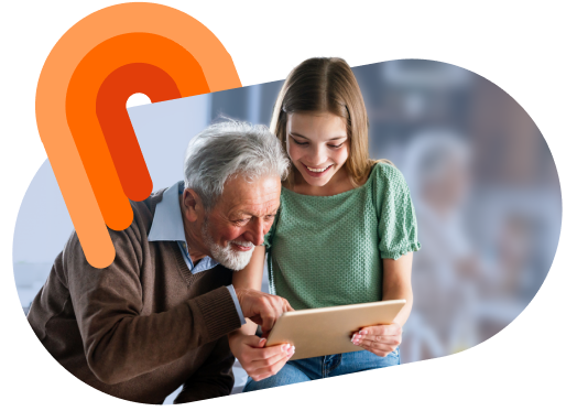 Nonno e nipotina guardano insieme un tablet